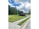 Corner lot featuring lush green grass and established trees at 540 Langley Creek Dr, Loganville, GA 30052