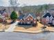 An elevated view showing the brick home, mature trees, and well-maintained landscaping at 1677 Angelica Ct, Lawrenceville, GA 30043