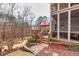 Multi-level deck and a landscaped backyard with stone pathways and mature trees at 1677 Angelica Ct, Lawrenceville, GA 30043