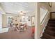 Basement area with dining table and stairs with carpet runner at 1677 Angelica Ct, Lawrenceville, GA 30043