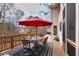 Outdoor deck with dining set, seating area, and views of the surrounding neighborhood at 1677 Angelica Ct, Lawrenceville, GA 30043