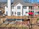 Exterior view of the house featuring a multi-level deck and landscaped backyard at 1677 Angelica Ct, Lawrenceville, GA 30043