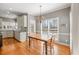 Bright kitchen with gray cabinets, stainless steel appliances, and a charming breakfast area at 1677 Angelica Ct, Lawrenceville, GA 30043