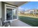 Back patio with view of a lawn and other homes at 24 Aspen Way, Dallas, GA 30157