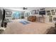 Basement with carpet flooring features fan, windows, and a leather sofa at 24 Aspen Way, Dallas, GA 30157