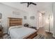 Comfortable bedroom with a rustic wooden headboard and ceiling fan at 24 Aspen Way, Dallas, GA 30157