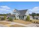 Charming exterior showcasing the craftsman-style architecture and well-manicured front yard at 24 Aspen Way, Dallas, GA 30157