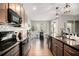 Stylish kitchen featuring stainless steel appliances, subway tile backsplash, and an adjacent dining area at 24 Aspen Way, Dallas, GA 30157