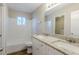 Bright bathroom featuring a double sink vanity with granite countertops and a bathtub and shower combo at 3225 Redona Dr, Atlanta, GA 30349