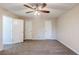 Bedroom with fresh grey carpet, three white doors and ceiling fan at 3225 Redona Dr, Atlanta, GA 30349