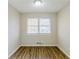 Bedroom with a window and wood-look floors, offering ample natural light at 3225 Redona Dr, Atlanta, GA 30349