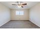 Bedroom with a window and grey carpet and ceiling fan at 3225 Redona Dr, Atlanta, GA 30349