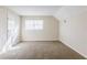 Neutral bedroom with carpet, a window for natural light, and a closet for storage at 3225 Redona Dr, Atlanta, GA 30349