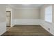 Dining room featuring wood-look floors, wainscoting, and natural light at 3225 Redona Dr, Atlanta, GA 30349