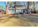 Charming two-story home featuring a landscaped front yard and second story balcony at 3225 Redona Dr, Atlanta, GA 30349