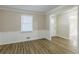 Living room featuring wood-look floors, wainscoting, and a large window offering ample natural light at 3225 Redona Dr, Atlanta, GA 30349