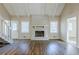 Open living room featuring a brick fireplace, wood-look floors, and lots of natural light at 3225 Redona Dr, Atlanta, GA 30349