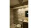 Bathroom featuring stylish fixtures, a stone accent wall, and recessed lighting at 620 Peachtree Ne St # 502, Atlanta, GA 30308