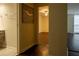 Hallway view leading to the updated bathroom and bright room with ceiling fan at 620 Peachtree Ne St # 502, Atlanta, GA 30308