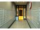 Hallway leading to the elevators, lined with mailboxes on either side at 620 Peachtree Ne St # 502, Atlanta, GA 30308