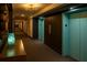 Hallway featuring elevator access and apartment entrances with modern decor at 620 Peachtree Ne St # 502, Atlanta, GA 30308