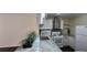 Close view of a modern kitchen featuring white cabinets, marble countertops and stainless appliances at 620 Peachtree Ne St # 502, Atlanta, GA 30308