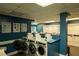 Convenient laundry room featuring modern washing machines and efficient dryers at 620 Peachtree Ne St # 502, Atlanta, GA 30308