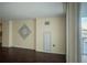 Bright living room featuring decorative wall hanging and a door to the balcony at 620 Peachtree Ne St # 502, Atlanta, GA 30308