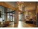 Bright lobby with marble columns, modern chandeliers, and a reception area at 620 Peachtree Ne St # 502, Atlanta, GA 30308