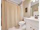 Neutral bathroom featuring patterned wall decor, a neutral curtain and white sink at 1355 Zephyr Ct, Cumming, GA 30041