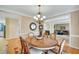 Traditional dining room features hardwood floors, chandelier, and elegant furnishings at 1355 Zephyr Ct, Cumming, GA 30041