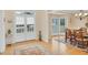 Bright dining area featuring French doors, a chandelier, and wood floors at 1355 Zephyr Ct, Cumming, GA 30041