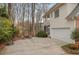 Home exterior with a basketball hoop, and multi-car garage at 1355 Zephyr Ct, Cumming, GA 30041