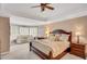 Spacious main bedroom featuring tray ceiling, sitting area, and large windows with plantation shutters at 1355 Zephyr Ct, Cumming, GA 30041