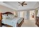 Main bedroom featuring a large bed, neutral decor and an ensuite bathroom and walk-in closet at 1355 Zephyr Ct, Cumming, GA 30041