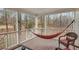 Covered porch featuring a hammock and outdoor seating, perfect for relaxing at 1355 Zephyr Ct, Cumming, GA 30041