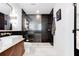 Elegant bathroom featuring a glass-enclosed shower, vessel sink, marble accents, and modern fixtures at 2047 Seavey Dr, Decatur, GA 30032