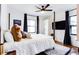 Bedroom featuring modern decor, ceiling fan, hardwood floors, and natural light from the window at 2047 Seavey Dr, Decatur, GA 30032