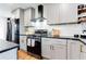 Modern kitchen with stainless steel appliances, white subway tile backsplash, and sleek countertops at 2047 Seavey Dr, Decatur, GA 30032