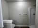 This bathroom features a white shower and a toilet with a white base at 225 Whirlwind Ct, Atlanta, GA 30349