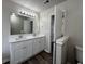 This bathroom features a double sink vanity and a large mirror with lighting at 225 Whirlwind Ct, Atlanta, GA 30349