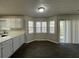 Dining area features modern wood look flooring, large bay window and sliding glass door at 225 Whirlwind Ct, Atlanta, GA 30349