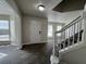 Entryway view showcasing wood-look flooring, staircase and natural light through multiple windows at 225 Whirlwind Ct, Atlanta, GA 30349