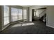 Bright living room showcasing wood-look tile flooring and natural light, connecting to staircase at 225 Whirlwind Ct, Atlanta, GA 30349