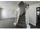 Inviting foyer features a staircase with white railings and wood-look tile flooring throughout the entryway at 225 Whirlwind Ct, Atlanta, GA 30349