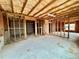 Unfinished basement with exposed framing, insulation, and concrete floor offers potential for customization at 3740 Crowchild Dr, Cumming, GA 30041