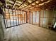 Unfinished basement with exposed framing, insulation, and concrete floor at 3740 Crowchild Dr, Cumming, GA 30041