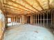 Unfinished basement with exposed framing, insulation, and concrete floor at 3740 Crowchild Dr, Cumming, GA 30041