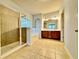 Bathroom with a tiled walk-in shower, soaking tub, and a double sink vanity at 3740 Crowchild Dr, Cumming, GA 30041