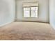 Cozy bedroom featuring neutral carpet and a bright window at 3740 Crowchild Dr, Cumming, GA 30041